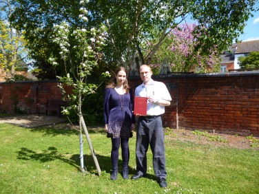 Jenny and Ant next to an apple tree in the Archives' garden